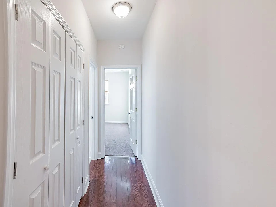 2nd floor hallway to bath and rear bedroom.
