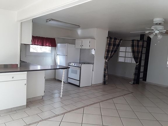 view of kitchen and corner nook off living room