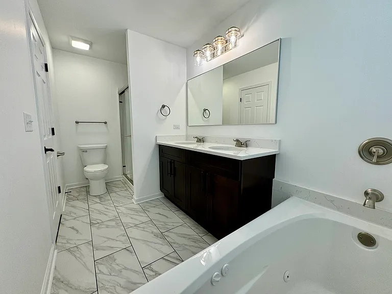 Master Bathroom with stand in shower, dual sink & soaking tub