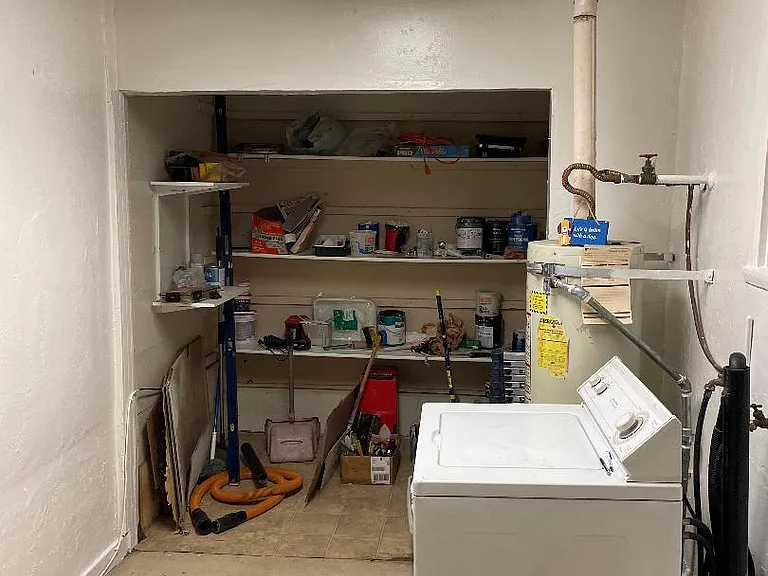 Store room outside of the kitchen creates complete noise separation from the one bedroom duplex next door.