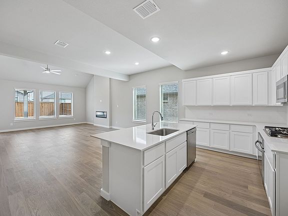 Kitchen in the Stanley II home plan by Trophy Signature Homes - REPRESENTATIVE PHOTO
