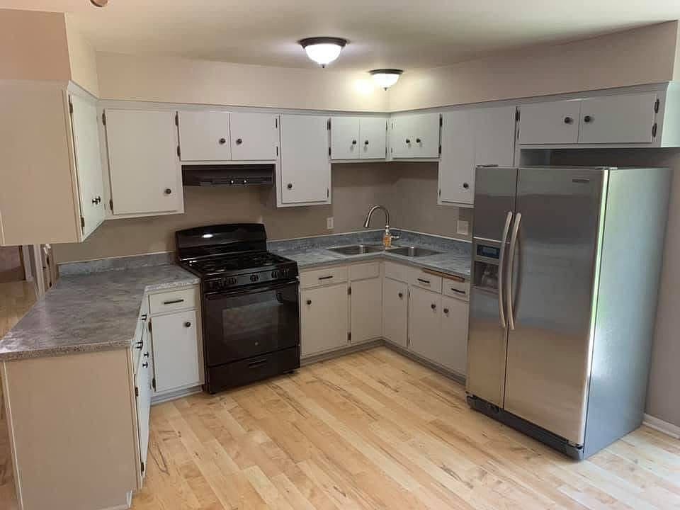 Kitchen with ample cabinet space. Unit will have NEW countertops, over-the-stove microwave and new sink