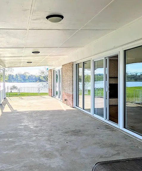 The HUGE covered porch. Lake views all the way around.