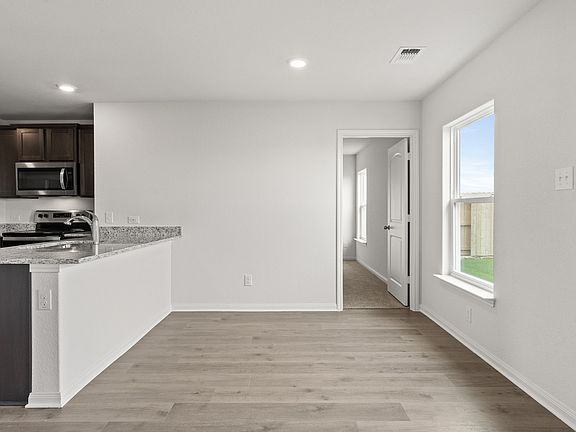 The dining room sits adjacent to the kitchen.