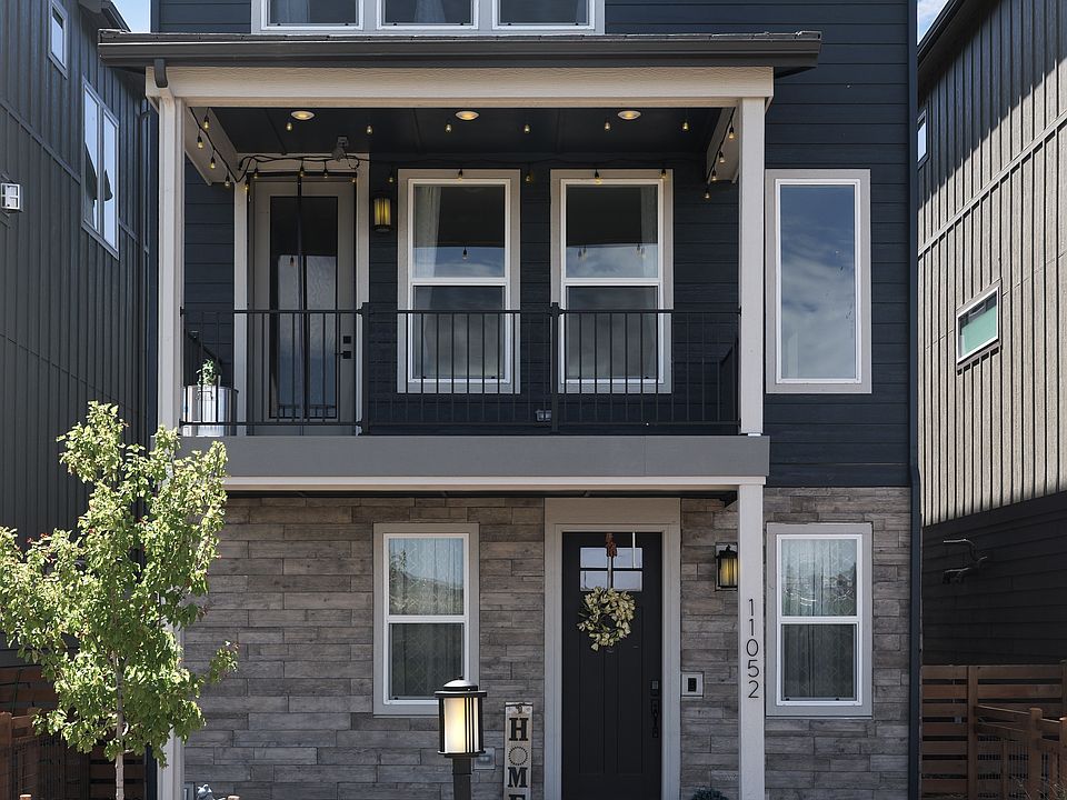 Beautifully landscaped with a welcoming front porch.