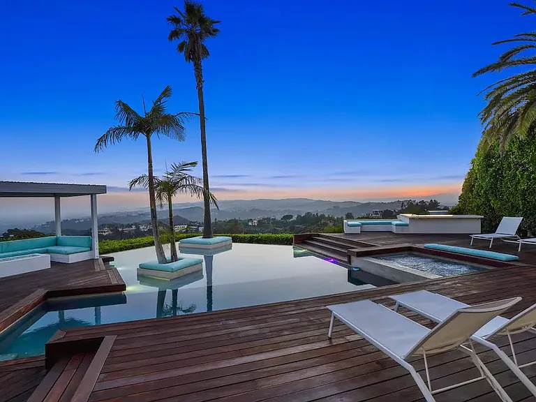 Watch the sunset from the poolside sunbeds, combining relaxation and stunning vistas for an unforgettable experience.