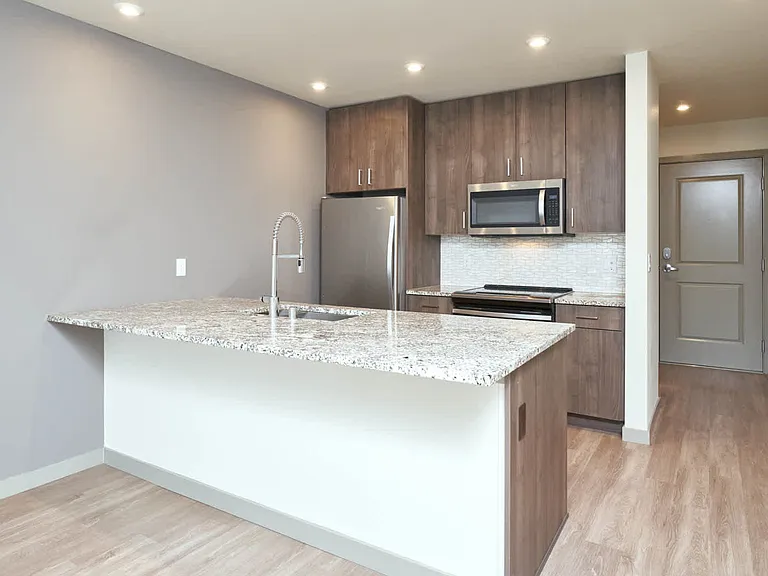 Kitchen with Breakfast Bar and Stainless Steel Appliances