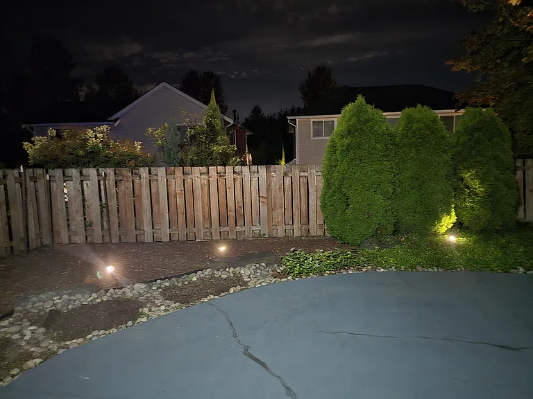 Backyard night view with automatic timer based lights