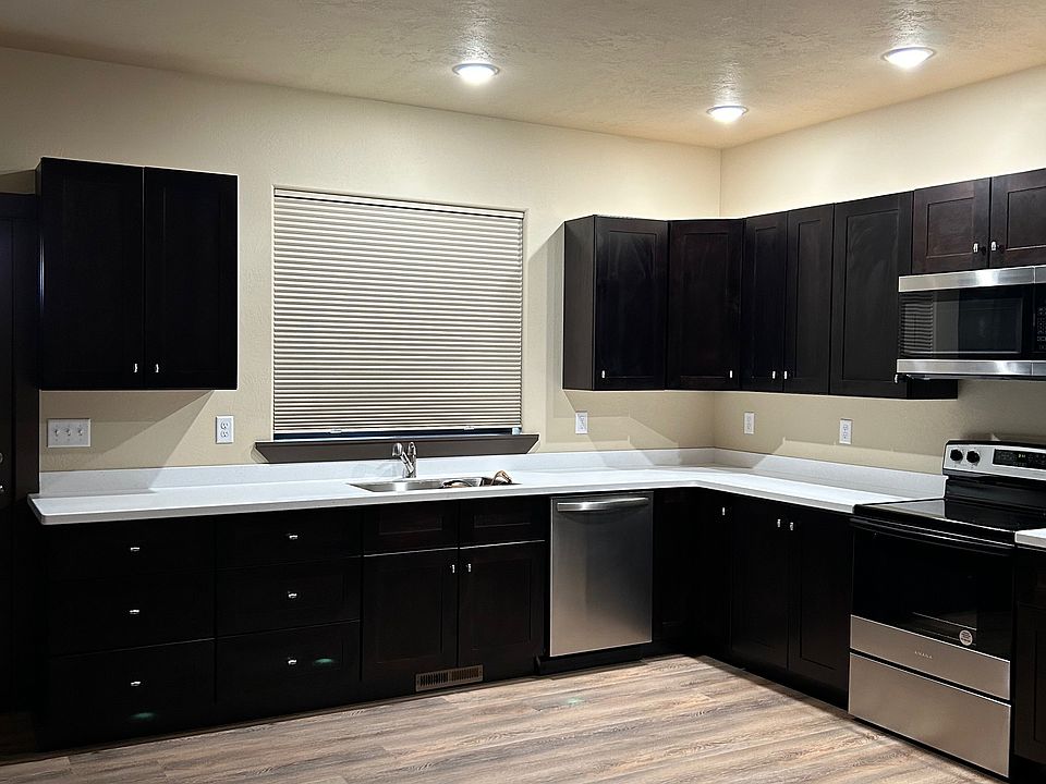 Unit B - Generously sized kitchen with stainless steel appliances