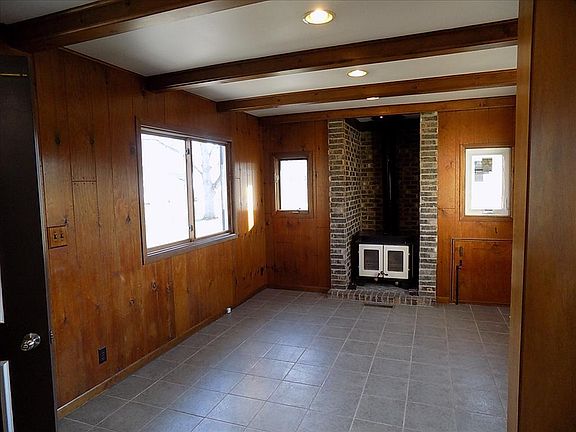 Back family room with wood stove for efficient heat