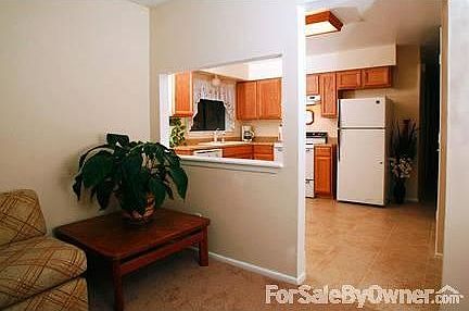 View into kitchen from living room
						:
						Open pass-thru can be easily converted to snack bar.