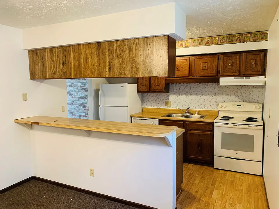 Kitchen. The counter accommodates bar seating on the back side.