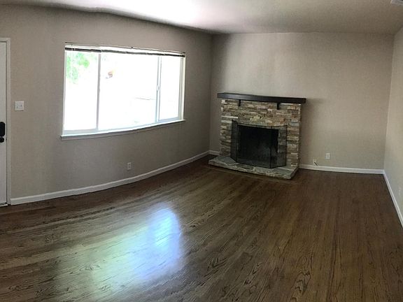 Family room with stacked stone fireplace