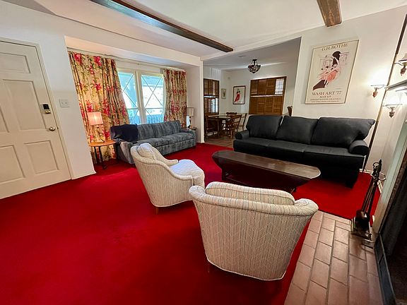 Front door, living room and dining