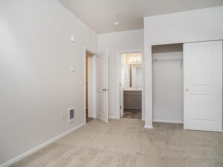 Bedroom with walk-in closet and private bathroom Bedroom with walk-in closet and private bathroom