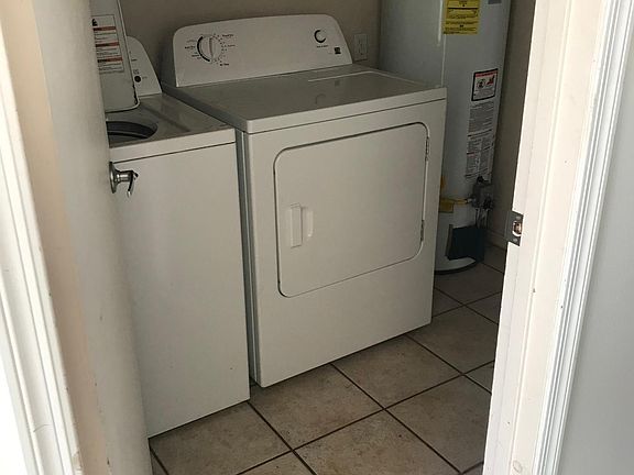 Laundry room connected to kitchen