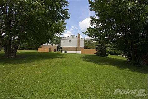 The rear yard boasts mature trees and a well-manicured lawn. The large fenced in patio will provide additional privacy & space that will be more than accommodating for all your outdoor entertaining or simply just relaxing and enjoying the great outdoors.
