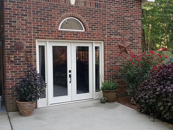 French doors grace the front of the cottage and bring in lots of natural light.