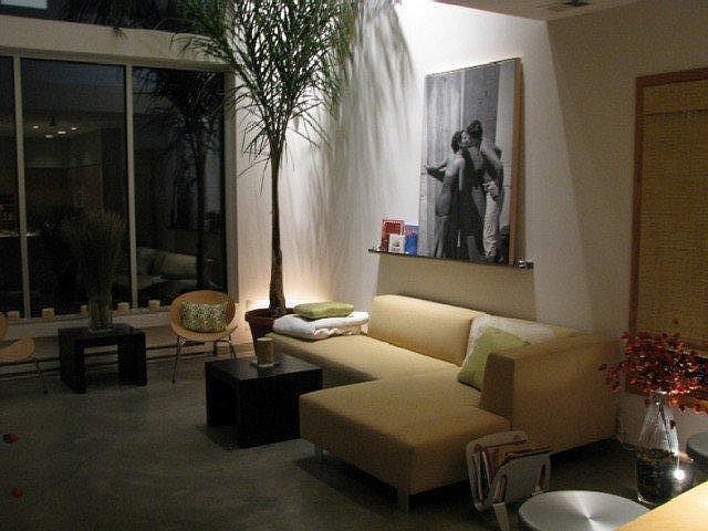 The Great room. This photo does not show it but there is a small dinning table with 4 chairs between the bar and the sofa