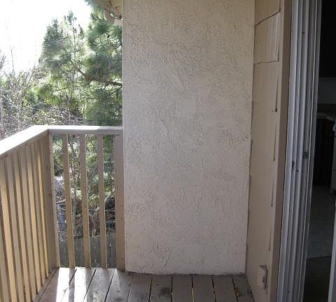 Nice Balcony to have coffee on in the morning with peek-a-boo views of ocean and palm trees - there is a storage closet off balcony.