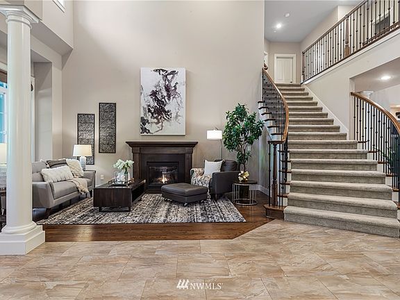 Sweeping iron stairway and cat walk above.