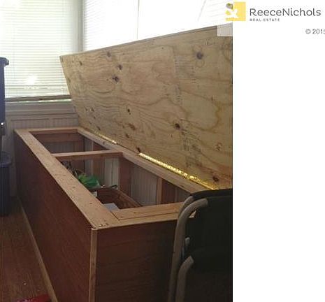 Storage bench access in sun room.