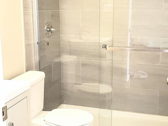 Newly remodeled bathroom w/ luxurious, floor-to-ceiling tiles!