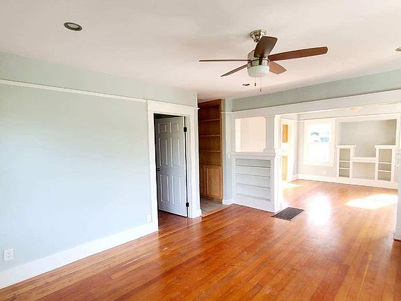 Living Room -hardwood floors and ceiling fan.