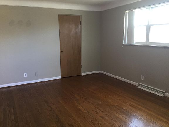 This is the other end of the living room with the coat closet. Nice Floors!
