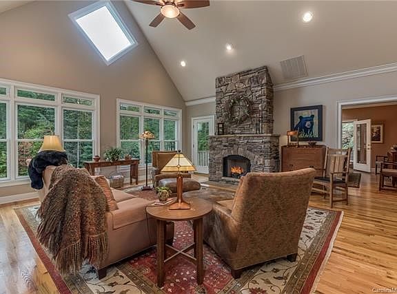 Lake view from living room with access to deck.  Custom windows bring in natural light.