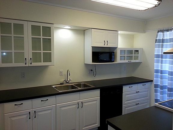 SPACIOUS KITCHEN WITH RECENT CABINETS/COUNTER TOPS, LIGHT FI