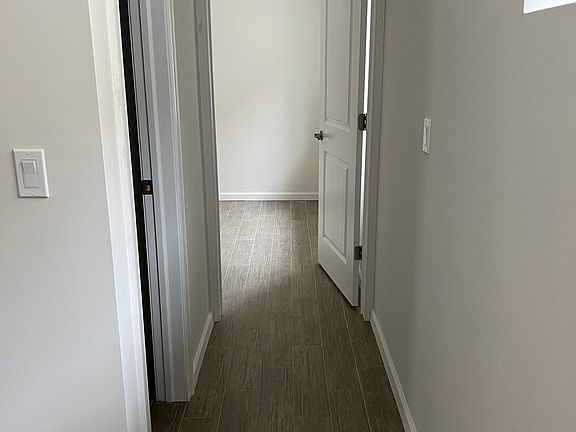 Hallway leading to bathroom and bedroom