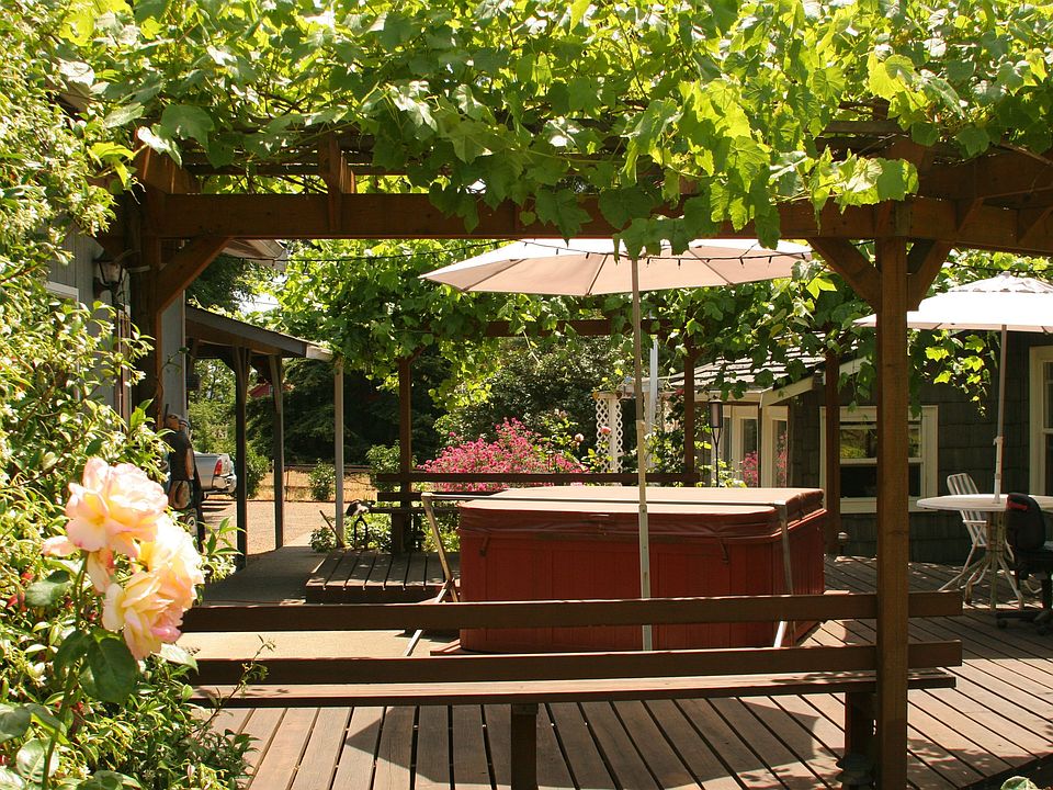 Hot tub with grape arbor and private deck