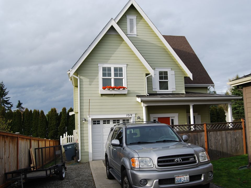 Home is tucked back away from the street, long driveway for