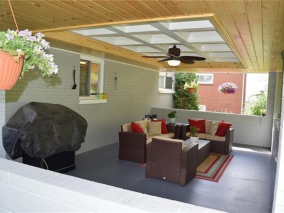 A coffered ceiling makes this outdoor space a truly stunning