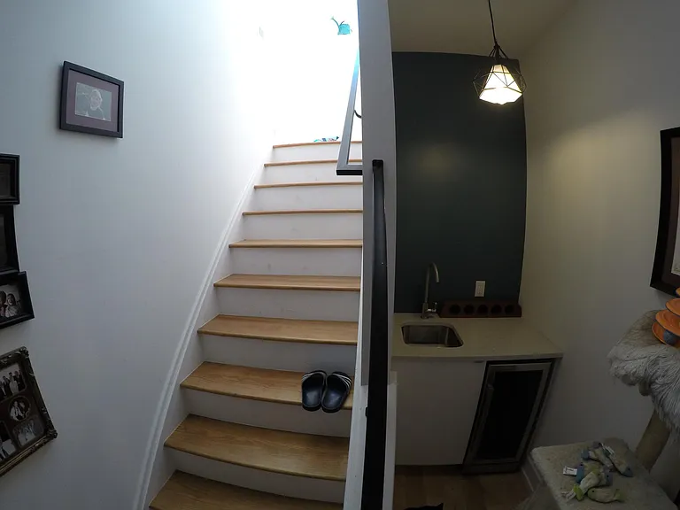 3rd floor wet bar and stairs to rooftop