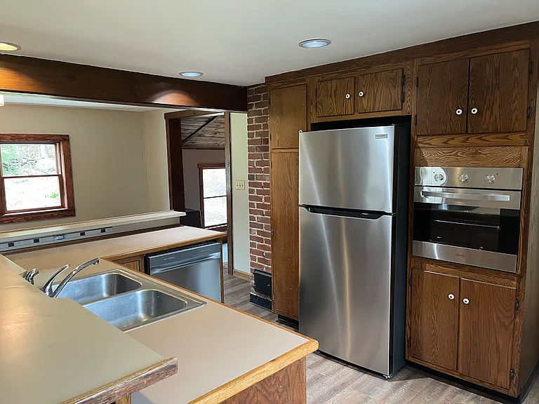 Brand new stainless dishwasher, refrigerator, wall oven and luxury vinyl plank flooring.