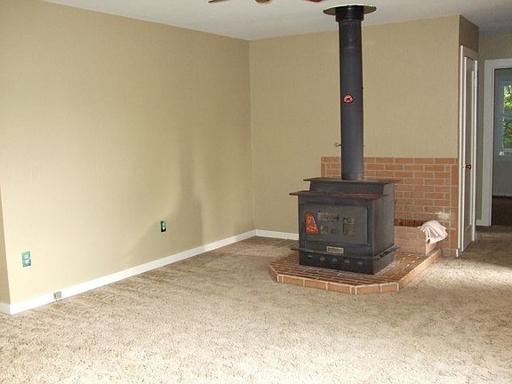 living room with wood stove