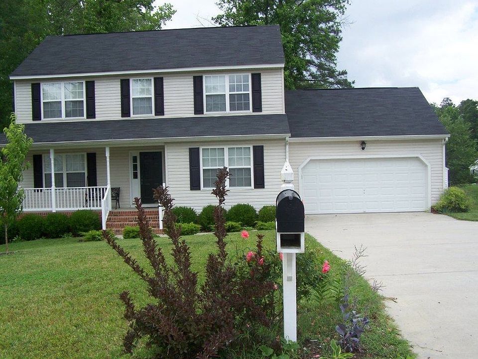 front view, garage with plenty of parking in driveway