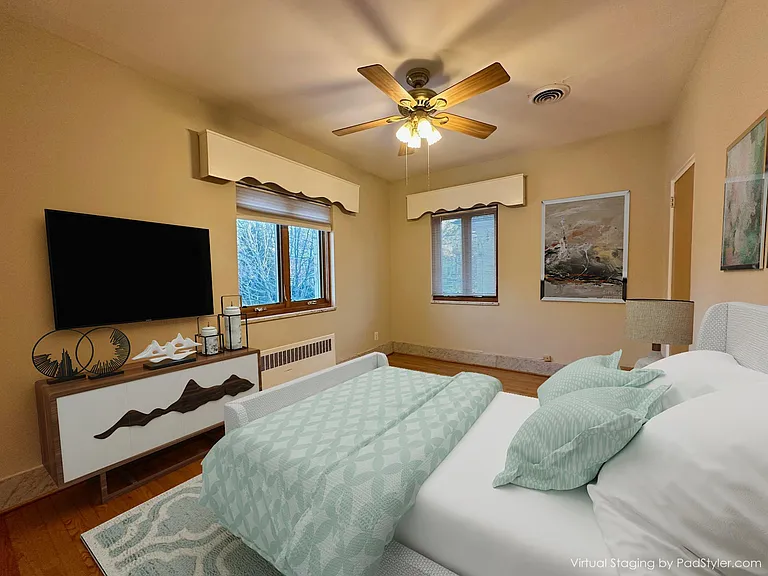 Comfortable bedroom facing East (street side view).