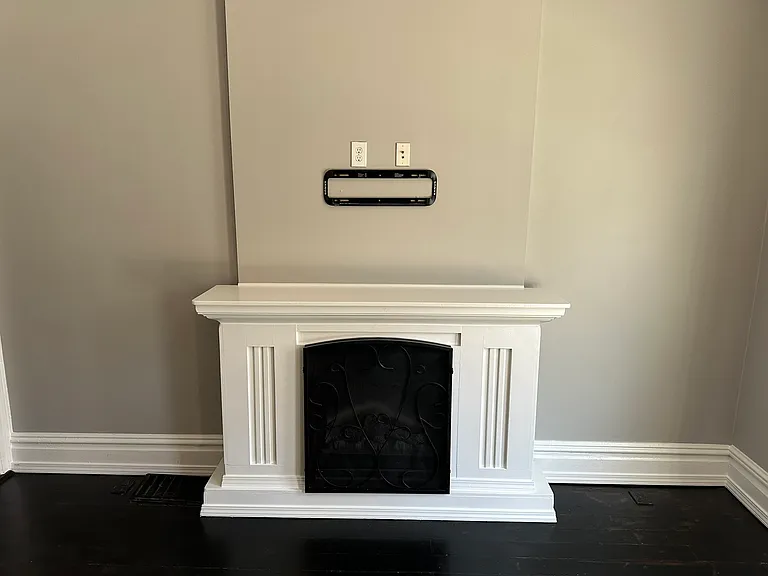 Fireplace with electric heater and TV mount