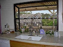 Pop-out garden kitchen window w/glass shelving. Ideal for your indoor plants!