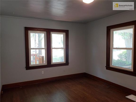 LIVING ROOM HAS GREAT NATURAL LIGHT WITH MANY WINDOWS