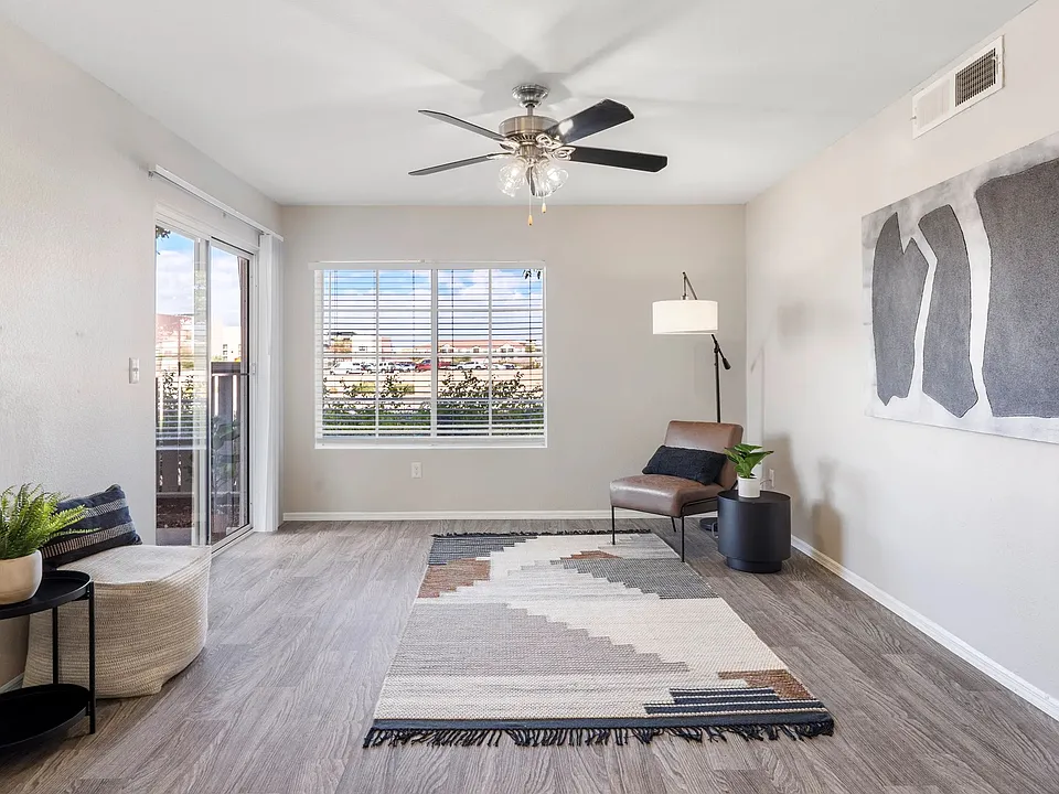 Pleasure in refined wood-style floors, sliding doors leading to your private patio, large windows, and a ceiling fan gracing our spacious living rooms.