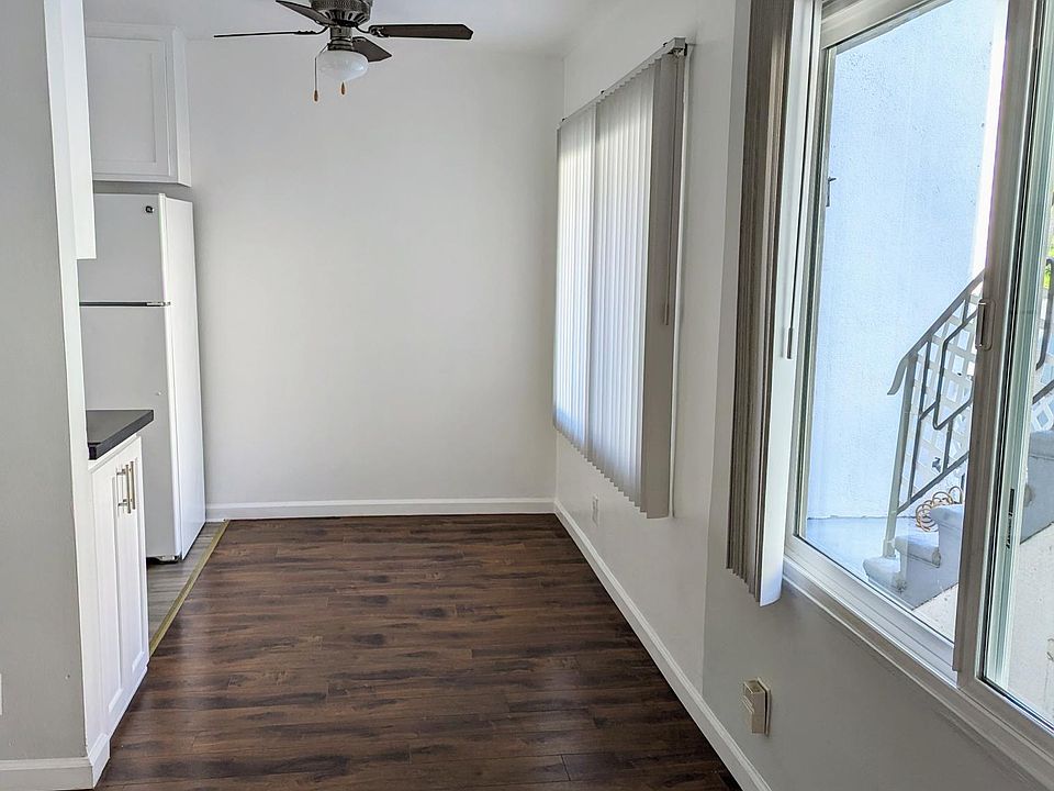 View from the living room looking towards the dining area and kitchen.