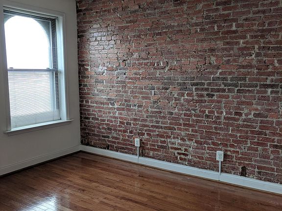 Exposed historic brick wall another view of the living room
