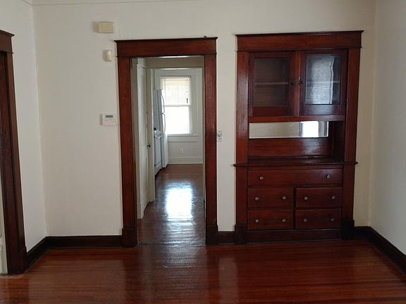 Original-trim, built-in cabinet in dining room