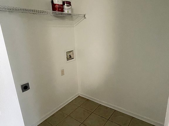 laundry room with washer/dryer connections and storage