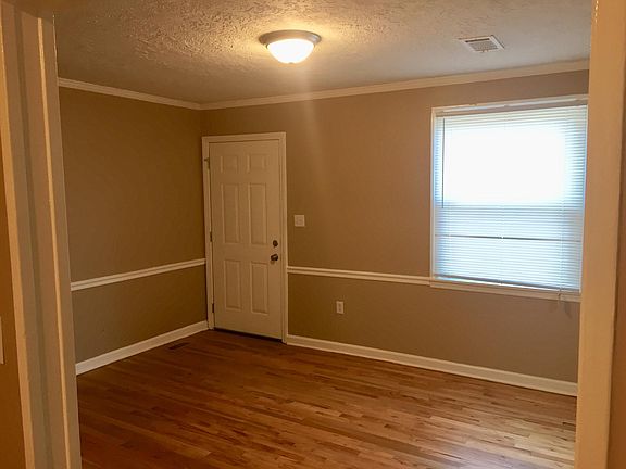 The front door opens into the living room with lots of natural lighting.