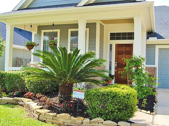 Gorgeous Front Elevation has lots of Curb Appeal !!!! Notice the Fully Landscaped Front Yard & Tree...Easily Maintained by the New Owners....
